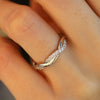 Torsade - Twist Shank Round Cut Moissanite Ring