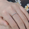 Torsade - Twist Shank Round Cut Moissanite Ring