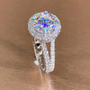 Rayonnement - Halo Split Shank Round Cut Moissanite Ring